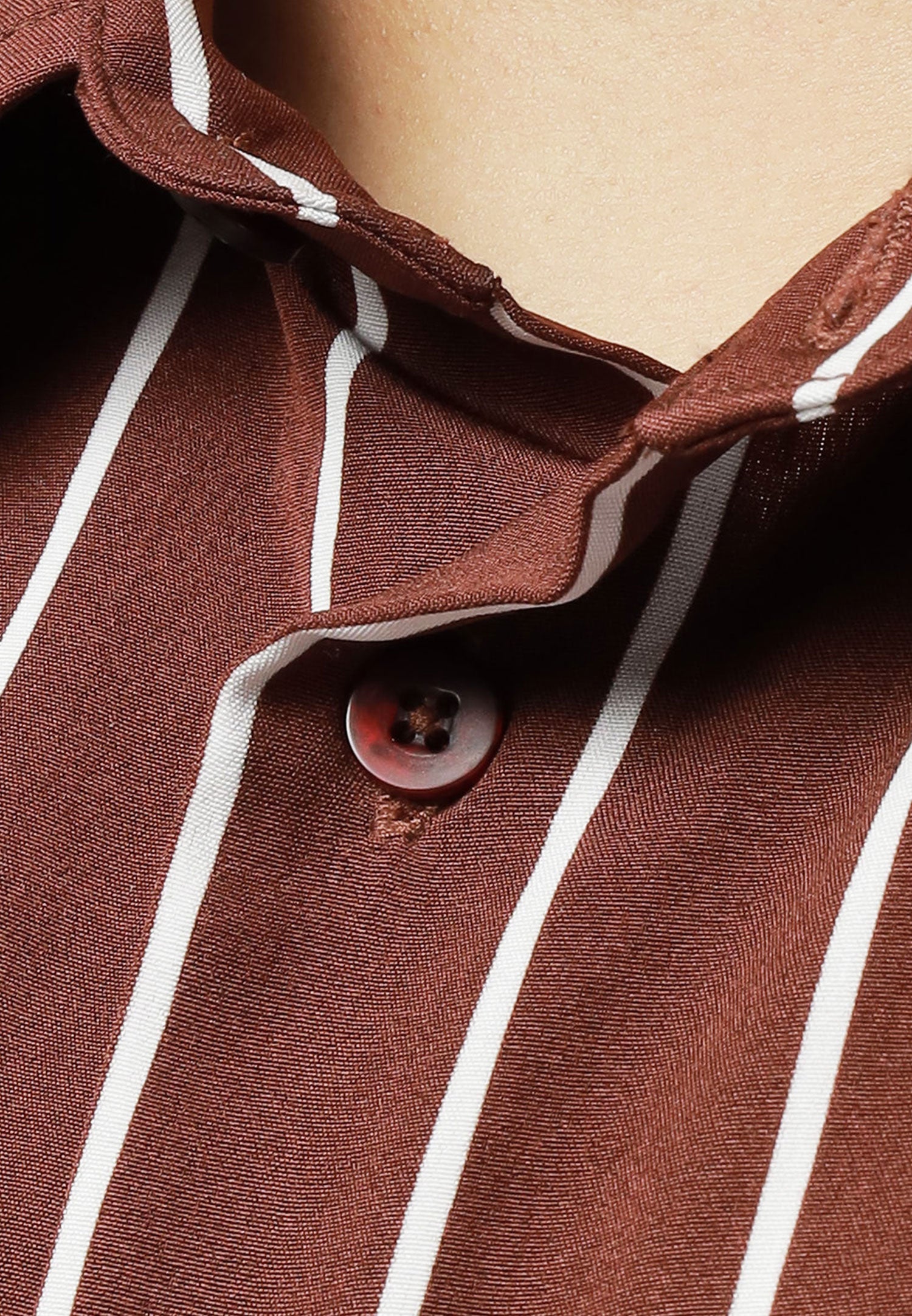 A close up of pointed collar for brown shirt with white stripes #color_brown