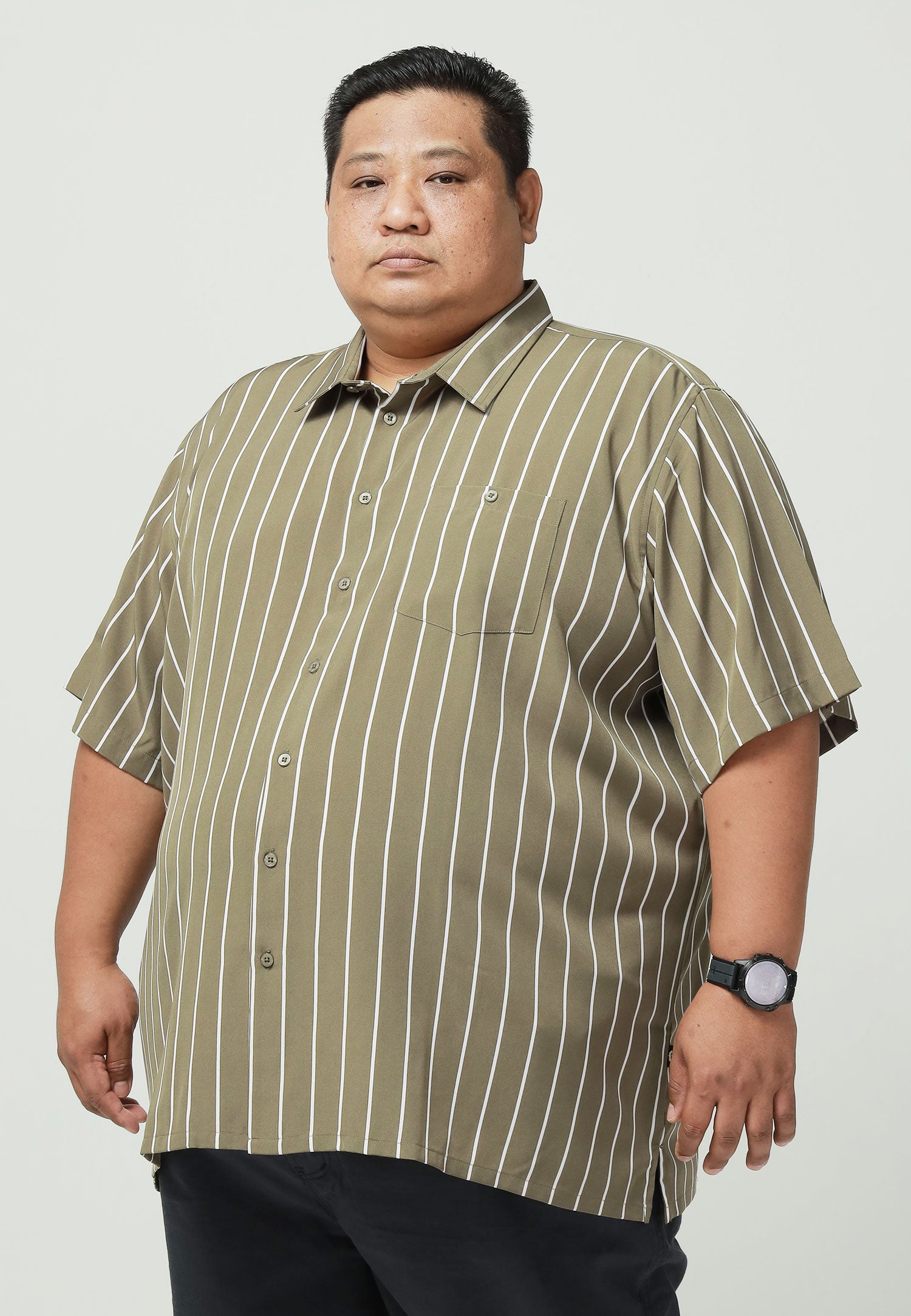 A plus-size male model wearing an olive green shirt with white stripes #color_olive green