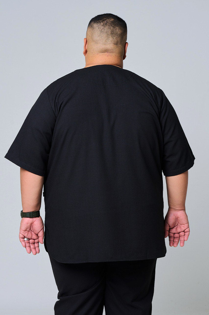 Person wearing a back black shirt and pants on a plain background #color_black
