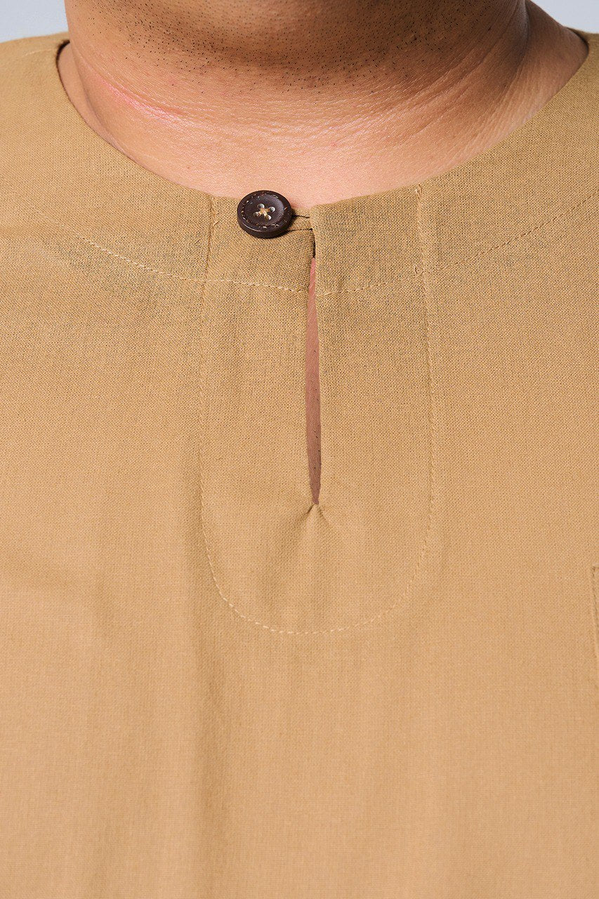 Close-up of a brown shirt with a button on a plain background #color_brown
