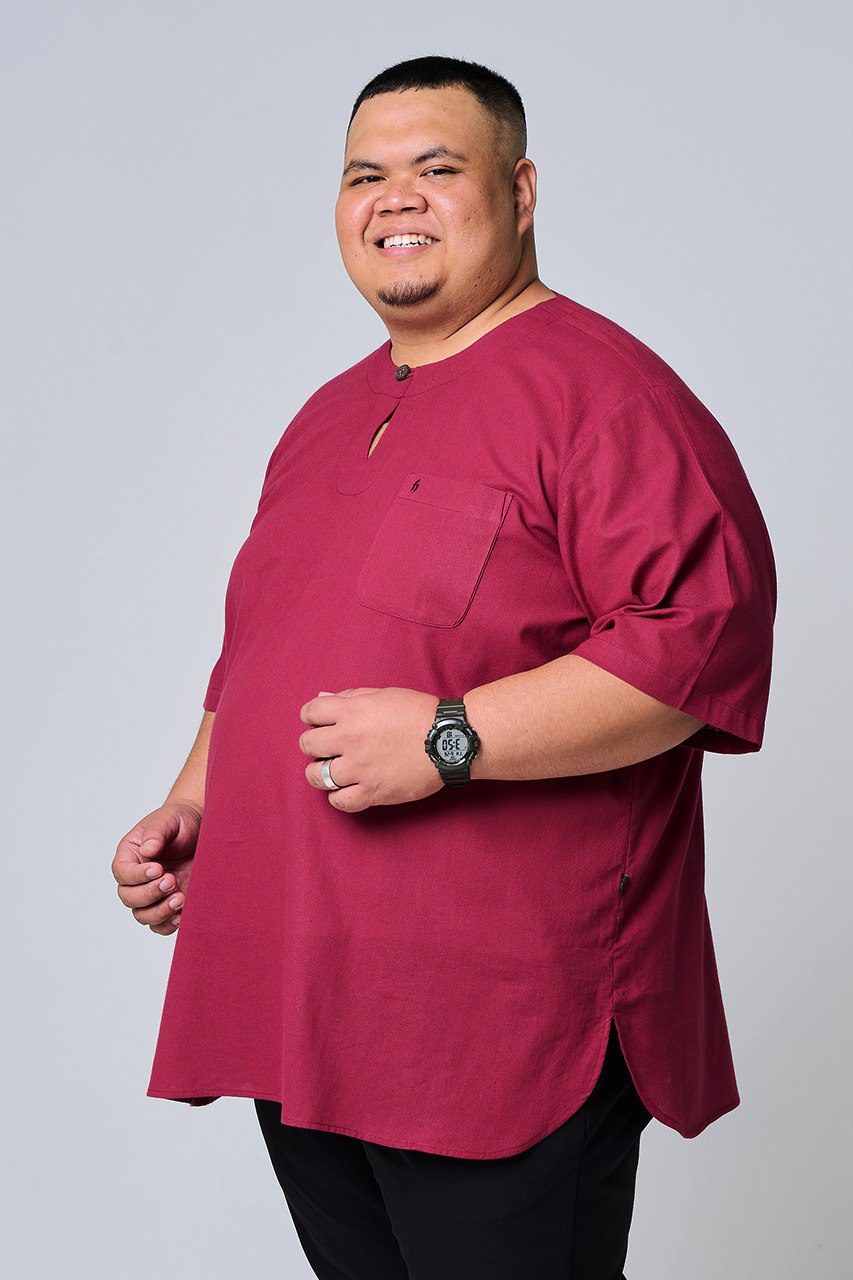 Man wearing a maroon shirt with a pocket on a plain background #color_maroon