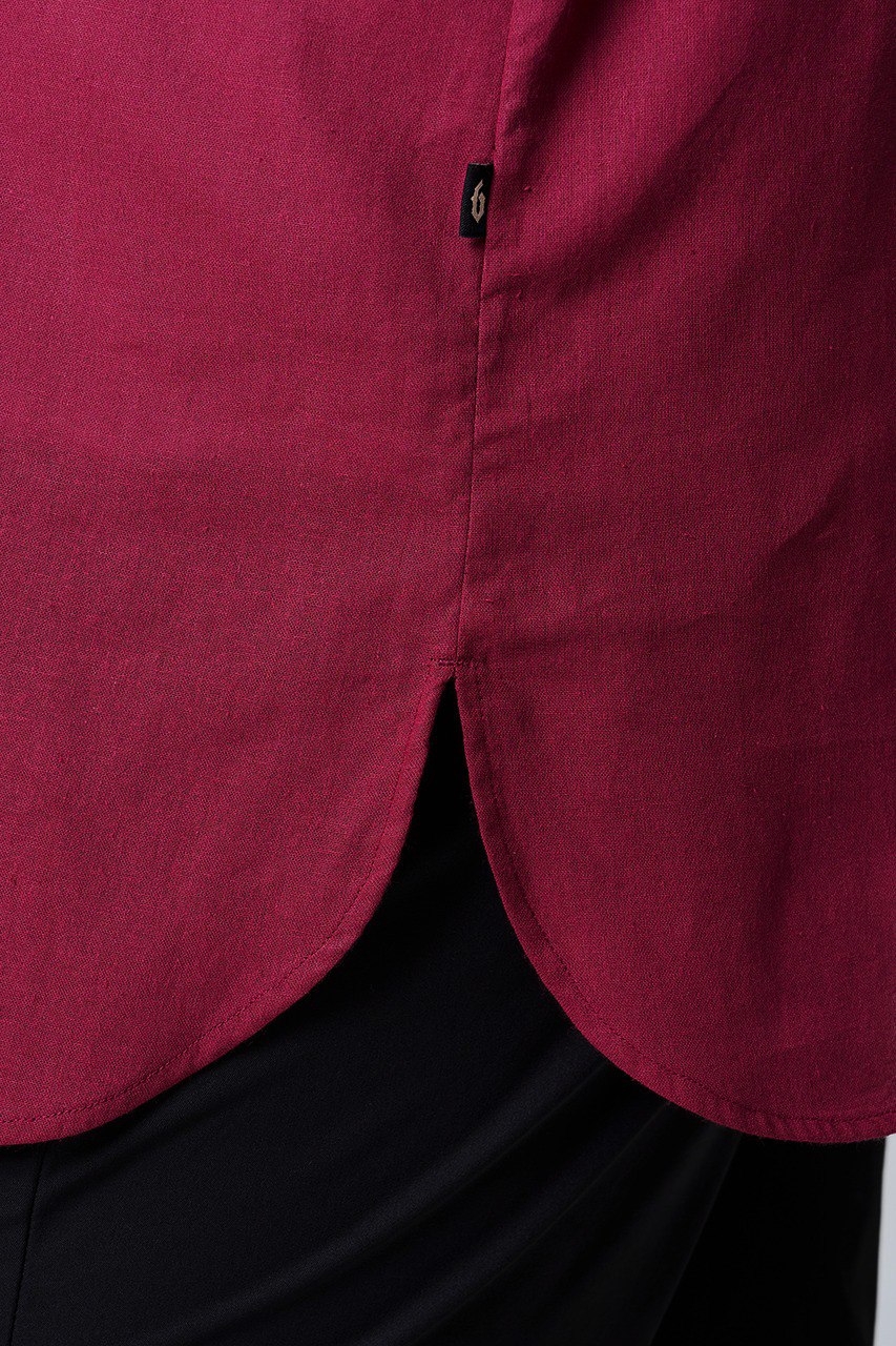 Close-up of a maroon shirt on slits with curve hemline #color_maroon