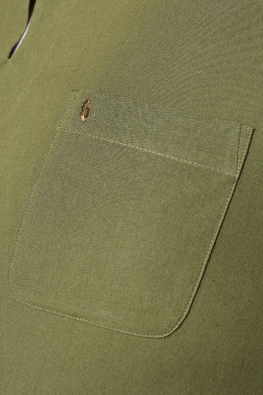 Close-up of a green fabric pocket with a brand logo #color_olive green