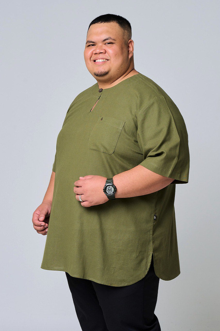 Man wearing an olive green shirt with a plain background #color_olive green