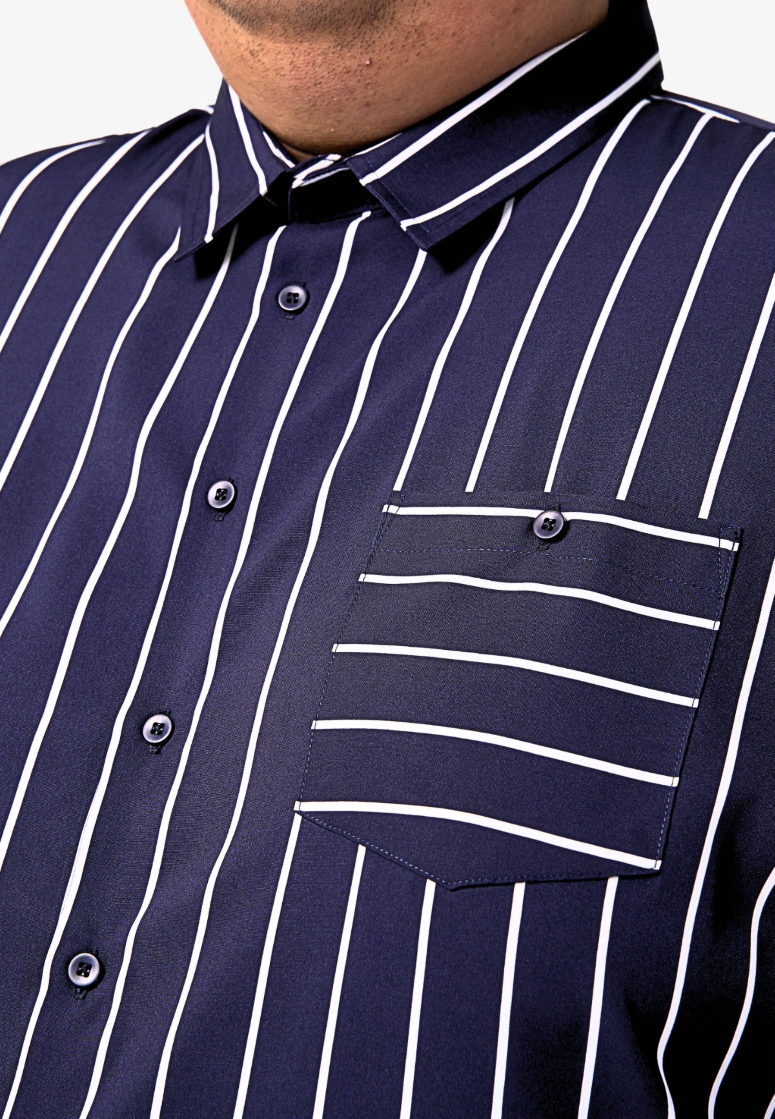 A close-up of the pointed collar and left chest pocket with button of a dark blue shirt with white stripes #color_dark blue
