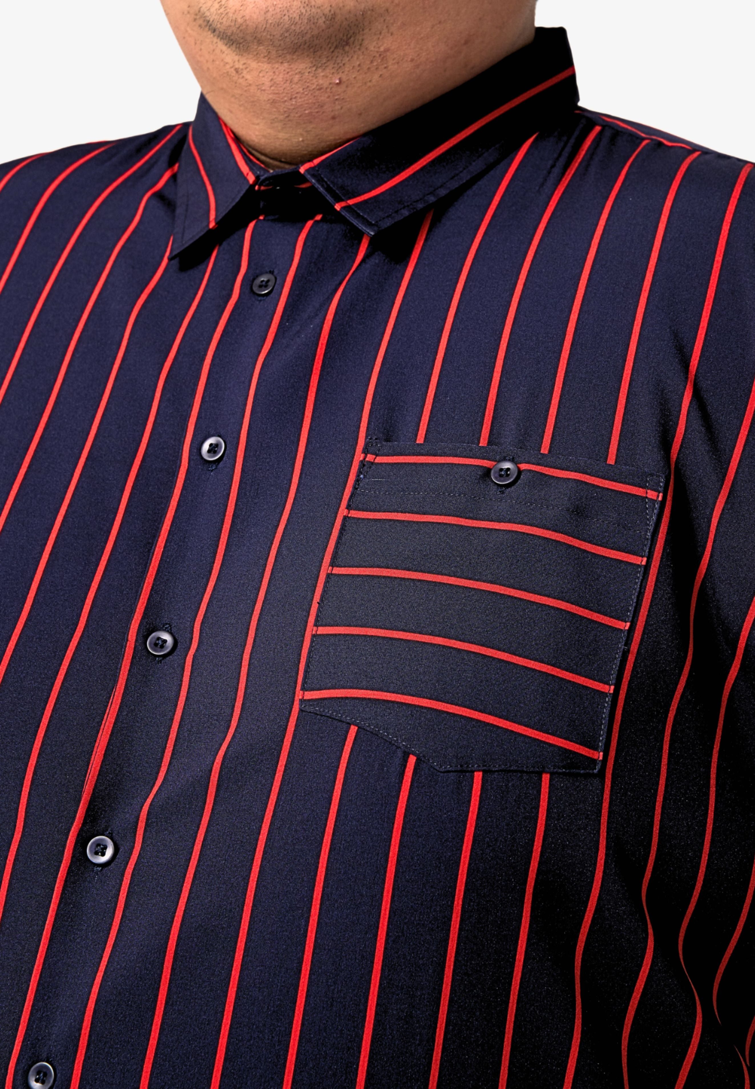 A close up of pointed collar and left chest pocket with button for navy blue shirt with red stripes #color_navy blue