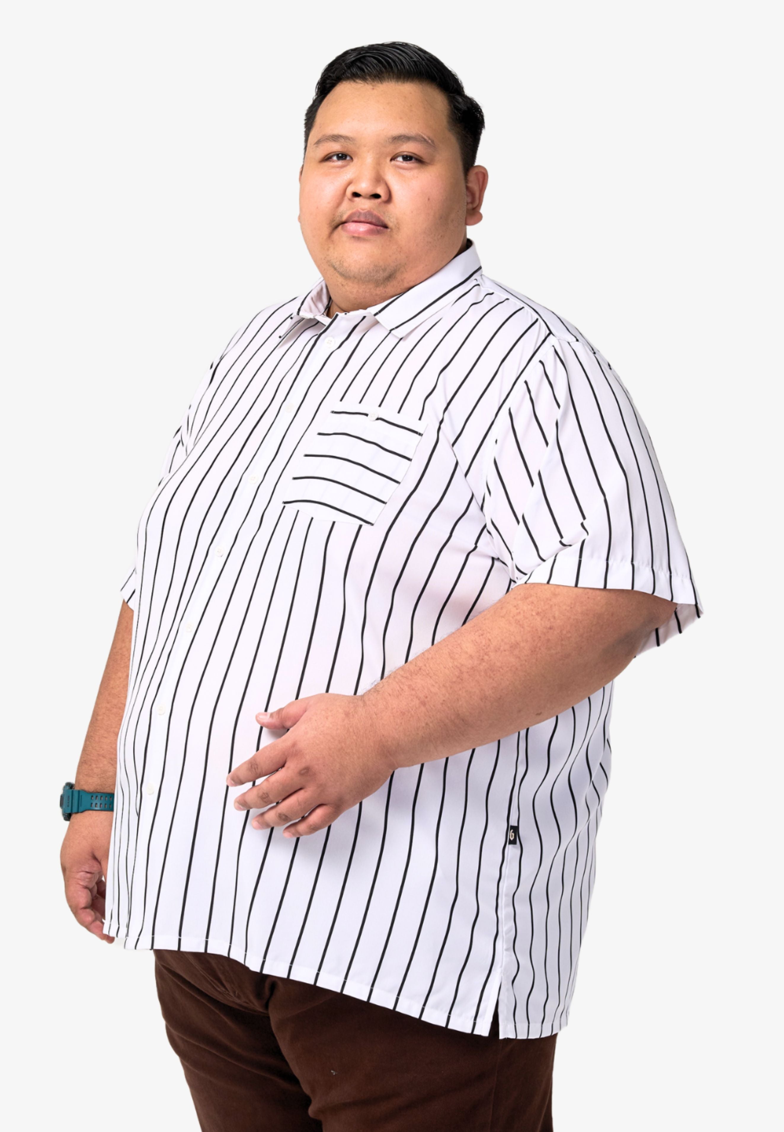 A plus-size male model wearing a white shirt with black stripes #color_white